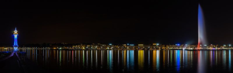 Le jet d'eau de Genève de nuit avec la rade