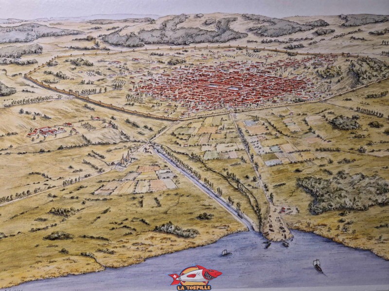 La ville romaine d'Avenches avec, au premier plan, le lac de Morat. On remarque bien le mur d'enceinte qui encerclait la ville.. Ruines Romaines d'Avenches, canton de Vaud.
