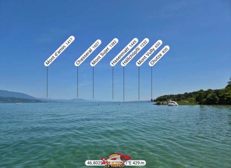 La vue, direction nord-est, depuis la plage de Châble-Perron. Le Chasseral, le Mont Sujet, le Mont Vully. La vue, direction nord-est, depuis la plage de Châble-Perron. Le Chasseral, le Mont Sujet, le Mont Vully.